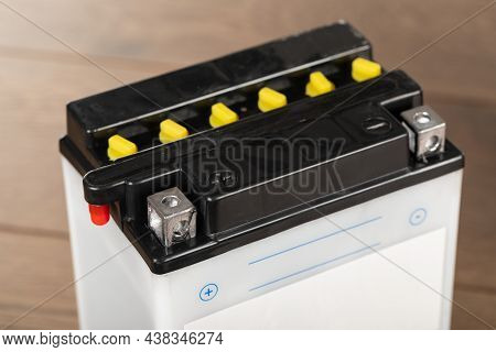 Lead Acid Rechargeable Batteries On Wooden Planks Background
