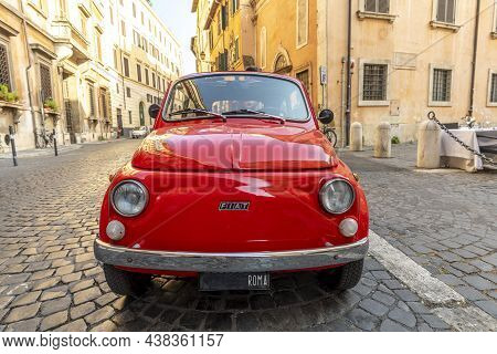 Vintage Fiat 500 Parked Next To A Restaurant In Rome In The Inner City At Quarter Regla On Cobblesto