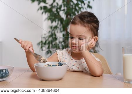 Cute Little Girl Refusing To Eat Her Breakfast At Home