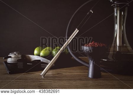 Hookah Bowl With Tobacco Citrus Fruits On Dark Background