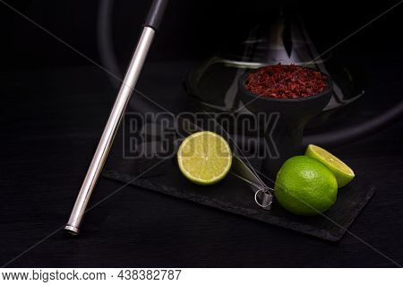 Hookah Bowl With Tobacco Citrus Fruits On Dark Background