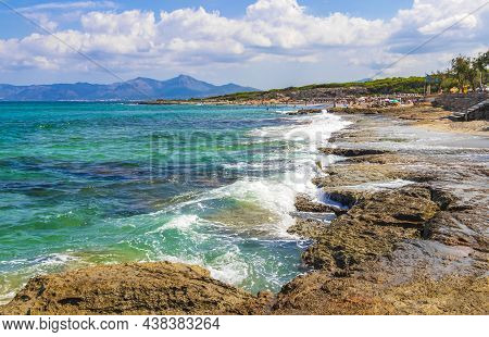 Rough Natural Coastal And Beach Landscape Panorama With Turquoise Water Waves Mountains Rocks Boulde