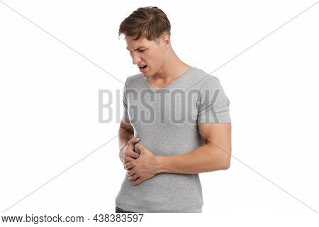 Sad Unhappy Despaired Millennial Caucasian Handsome Man Touching Sore Spot And Suffering From Pain I