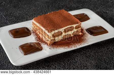 Portion Of Tiramisu - Italian Dessert Garniched With Chocolate