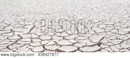 Cracked White Clay, Dried Lakebed Surface Texture. Panorama With Diminishing Perspective And Deep Fo