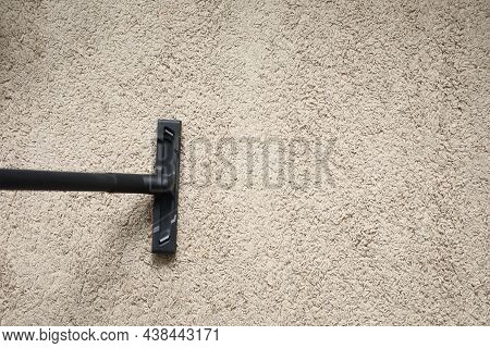 Top View Of Electrical Vacuum Cleaner Nozzle Cleaning Fluffy Beige Carpet At Home. Clean White Strip