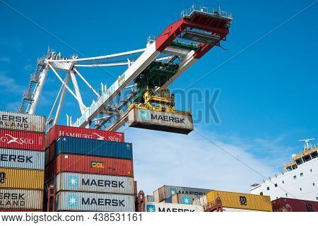 Le Havre, France - July 29, 2021: Crane Unloading Containership Hamburg With Containers Of Maersk, H