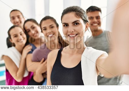 Group of young sporty people smiling happy make selfie by the smartphone at sport center.