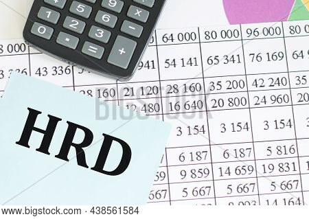 Business And Finance Concept. On The Table A Calculator And A Business Card On Which The Text Is Wri