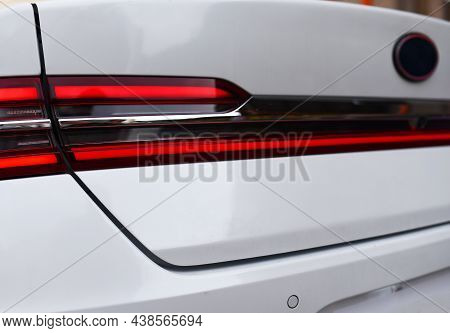 Rear Led Headlamp Of A Modern Car. Brake Taillight. Red Stop Lighting Of Highway Vehicles. Cars Ambi