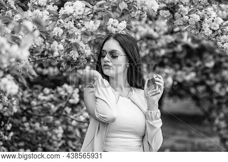 Pretty Woman Hold Perfume. Scented Water Cologne In Spray Bottle. Fragrance Lingers In The Air After