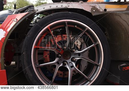 Alloy Wheel With Calipers And Racing Brakes Of The Sport Car. Racing Brake Disc And Low Profile Tyre