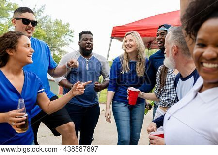 Friends partying at a tailgate event