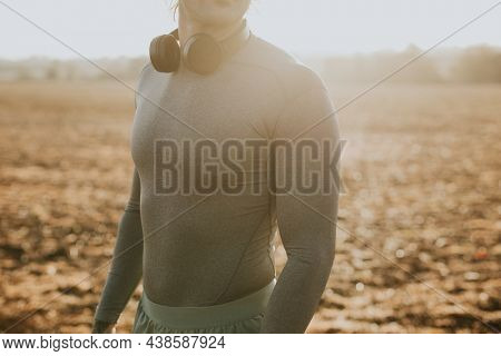 Man with  headphones around his neck closeup