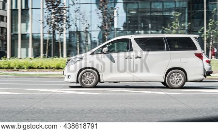 Toyota Alphard 350g Driving Along The Street In City With Blurred Background. Moscow, Russia - July 