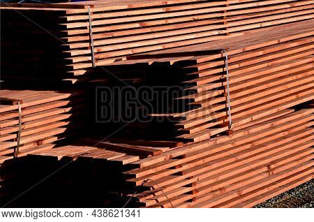 In The Yard We Work With Wooden Prisms And Planks To Repair The Roof. Saw, Cutter, Formats Them To T