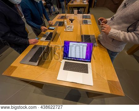 Paris France - Sep 24, 2021: Customer Talking With Genius About New Apple Computers Macbook Pro 16 I