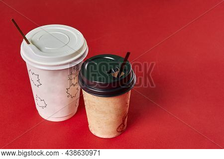Two Single-use Plastic Coffee Cups On Red Background With Copy Space