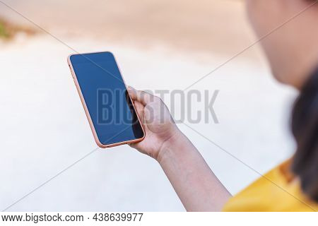 Hand With Smart Phone Black Screen Blurred Background
