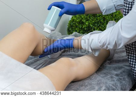 Depilation Spa Procedure. Female Legs Being Smoothed With Powder During Liquid Wax Or Sugaring Proce