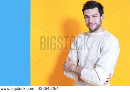 Youth Lifestyle. Positive And Confident Caucasian Young Handsome Man With Folded Hands Posing In War