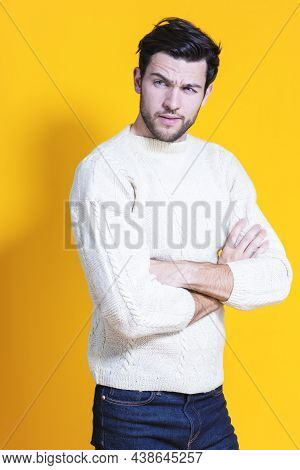 Youth Lifestyle. Positive And Confident Caucasian Young Handsome Man With Folded Hands Posing In War