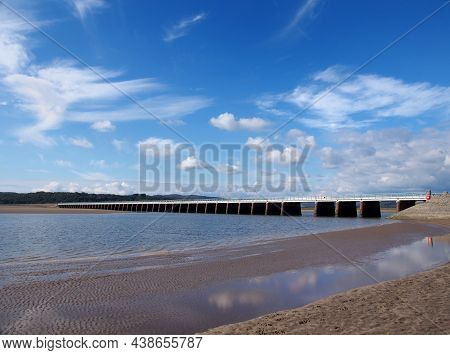 View Of The Beach At Arnside With The Leven Railway Viaduct And River In The South Lakes Area Of Cum