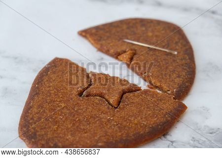 Kiev Ukraine - October 2021 Playing Korean Dalgona Or Ppopgi Honeycomb Candy From Squid Game Challen