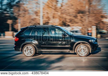 Black Shiny Bmw X5 E70 Suv Driving On The City Road With Blurred Autumn Background. Moscow, Russia -