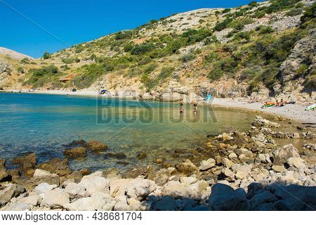 Stara Baska, Croatia - 6th September 2021. Tourists And Locals Enjoy A Secluded Beach On The Rugged 