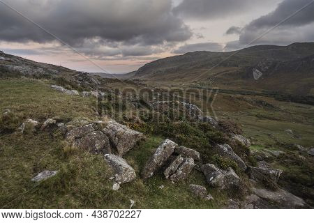Epic Dramatic Autumn Sunset Landscape Image Of Llyn Ogwen And Tryfan In Snowdonia National Park With