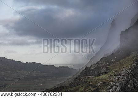 Epic Mountain Landscape Image Of Pen Yr Ole Wen In Snowdonia National Park With Low Cloud On Peak An