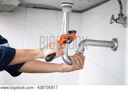 Plumber At Work In A Bathroom, Plumbing Repair Service, Assemble And Install Concept.