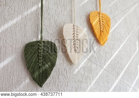 Macrame Leaves Wall Hanging In Yellow, White And Green  And Natural Color On The Wooden Stick. Cotto