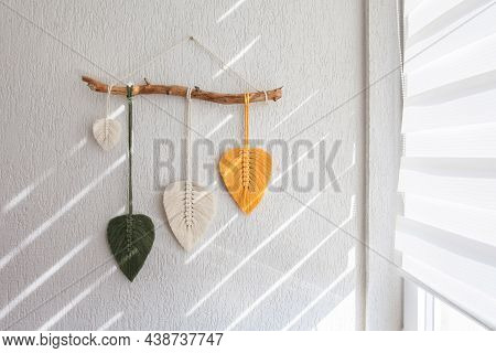 Macrame Leaves Wall Hanging In Yellow, White And Green  And Natural Color On The Wooden Stick. Cotto