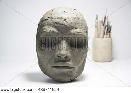Clay Face, Sculpture Modeling And Tools On White Background