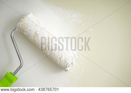 Roller Brush Painting, Painting Apartment, Renovating With White Color Paint, Space For Text. Close-