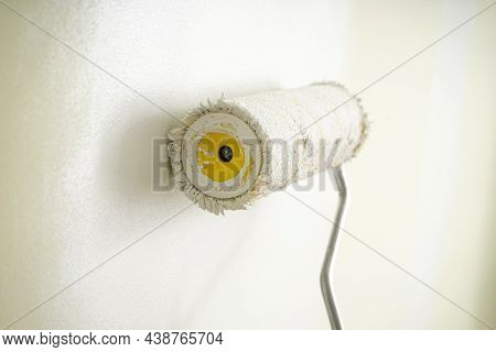 Roller Brush Painting, Painting Apartment, Renovating With White Color Paint. Close-up.