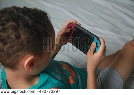 Salvador, Bahia, Brazil - November 6, 2021: Child Played Videgame Portatil In Salvador City.