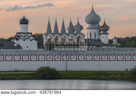 Domes Of The Tikhvinsky Assumption Monastery Against The Background Of The Sunset Sky. Tikhvin, Russ