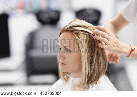 Portrait Of Female Client On Appointment At Hairdresser, Professional Master Creating Haircut, Touch