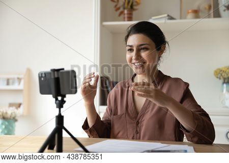 Indian Woman Record Videovlog On Cellphone Seated At Table