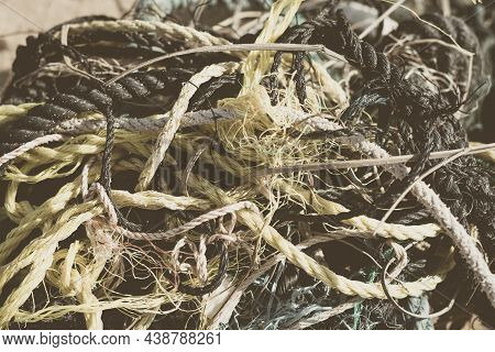 E Close Multi Colored Black White Yellow Old Fishing Twisted Cotton Ropes Heap Pile Jumble Detail. C
