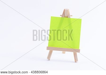 Wooden Easel Miniature With Blank Colored Square Canvas Or Memo Paper - Mockup. Mini Wooden Stand Wi