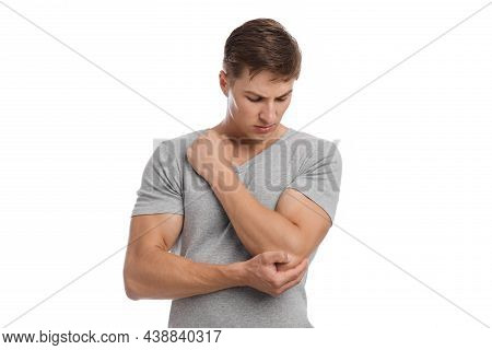 Sad Young Caucasian Handsome Guy Massaging Sore Spot, Suffer From Elbow Pain