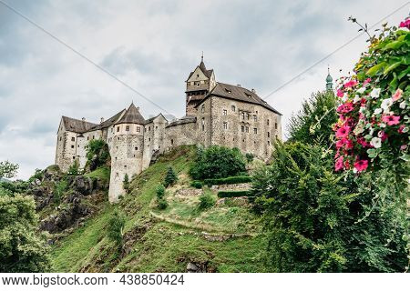 Panoramic View Of Famous Medieval Town Of Loket,elbogen, With Colorful Houses And Stone Castle Above