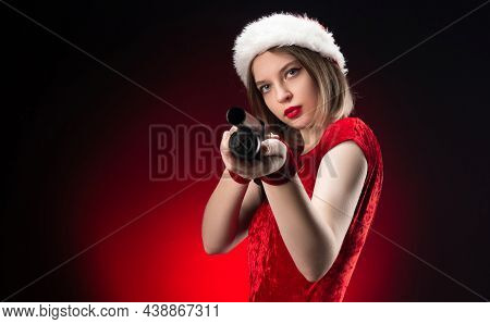 A Girl In A Red Bodysuit And A Santa Claus Hat With A Shotgun In Her Hands For Christmas