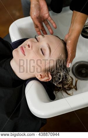 Woman getting a hair wash at a beauty salon