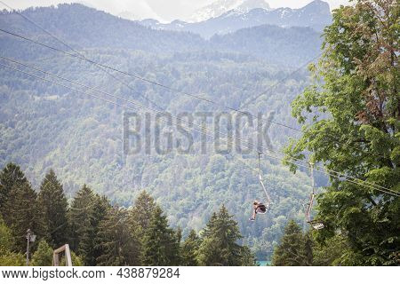 Bled, Slovenia - June 12, 2021: Selective Blur On A Young Boy On Ski Lifts In A Ski Resort, In Front