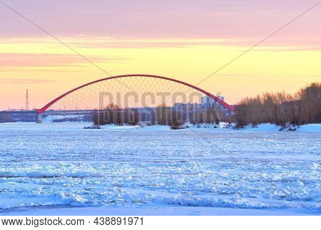 Winter Evening On The Ob. Ice Hummocks On The River, The Arch Bugrinskij Bridge Vdaleke